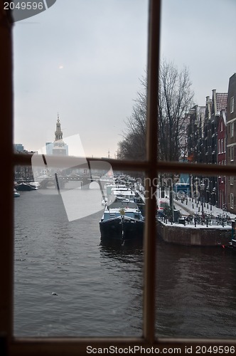 Image of Amsterdam in snow through window