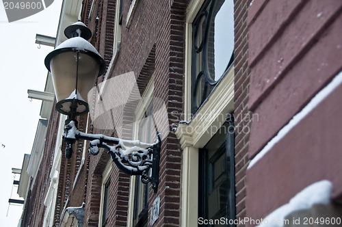 Image of Snow covered street light