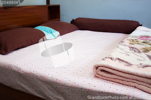 Image of Tranquil bedroom with with a double  hard wood bed