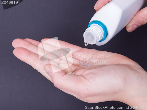 Image of Woman holds a Contact Lens