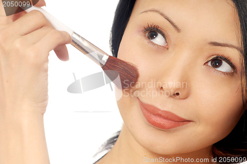 Image of Woman and powder brush