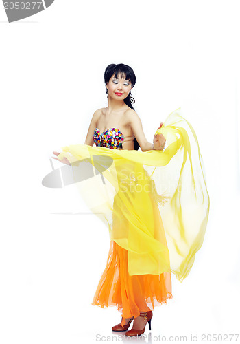 Image of Belly dancer with yellow fabric