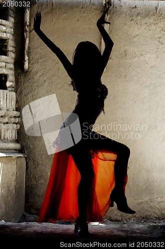 Image of Woman dancing belly-dance in Oriental costume