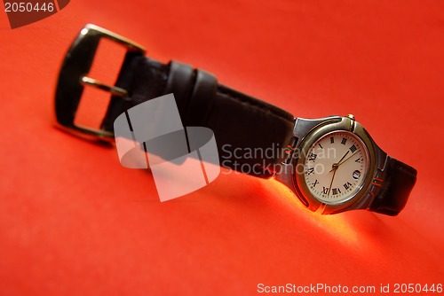 Image of Watch on a red