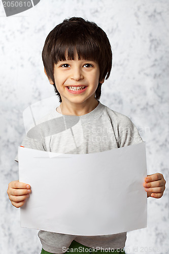 Image of enthusiastic boy  with  placard