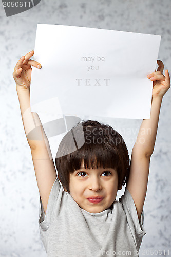 Image of enthusiastic boy  with  placard