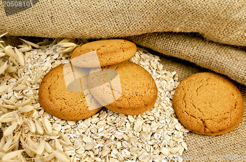 Image of Oatmeal cookies with oatmeal on sacking
