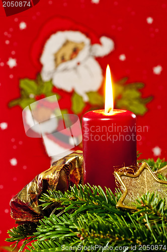 Image of candle with Santa Claus