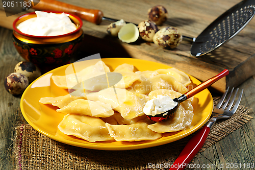 Image of Dumplings with sour cream.