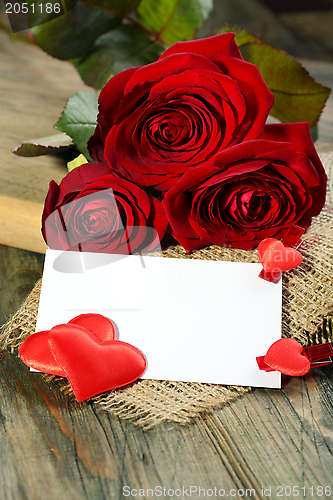 Image of Red hearts, postcard and roses.