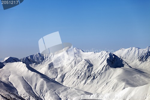 Image of Snowy mountains and blue clear sky