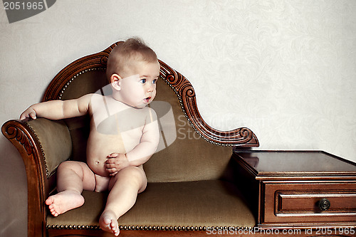 Image of Child sitting on a bench