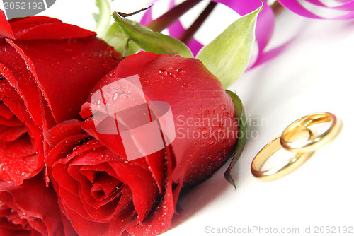 Image of Roses and wedding rings