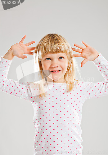 Image of Happy young girl looking up