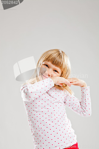 Image of Happy smiling young girl with raised hands