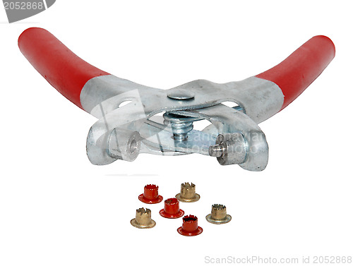 Image of Riveter with red handles and red and gold rivets