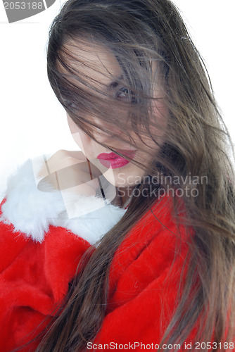 Image of Woman with long hair in Santa costume