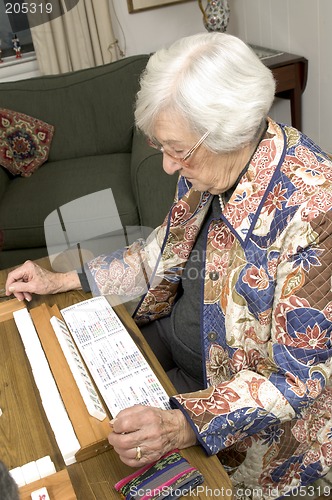 Image of senior woman at the game table