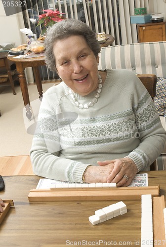 Image of senior woman at the game table