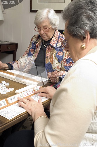 Image of senior woman at the game table