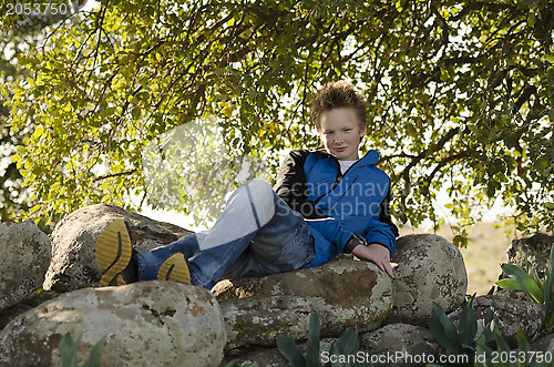 Image of Teenager setting in nature