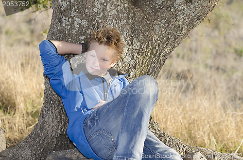 Image of Teen under tree