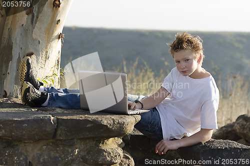 Image of Serious teen rest with notebook