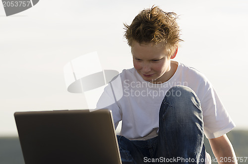 Image of Schoolboy with laptop