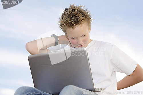 Image of Handsome boy rest with mobile computer