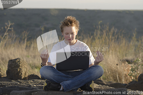 Image of Meditation in nature at sunset