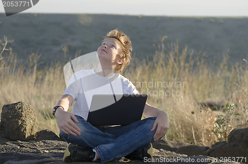 Image of Handsome kid look at the sky