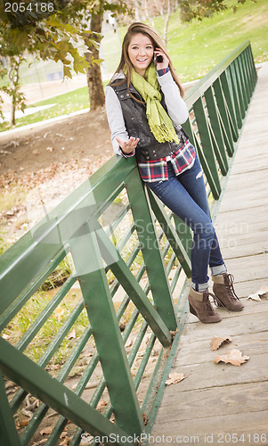 Image of Mixed Race Attractive Woman Using Cell Phone