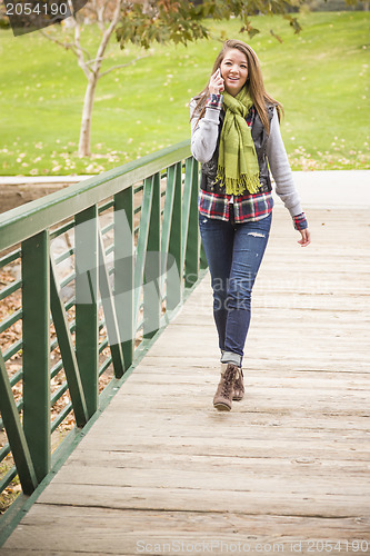 Image of Mixed Race Attractive Woman Using Cell Phone