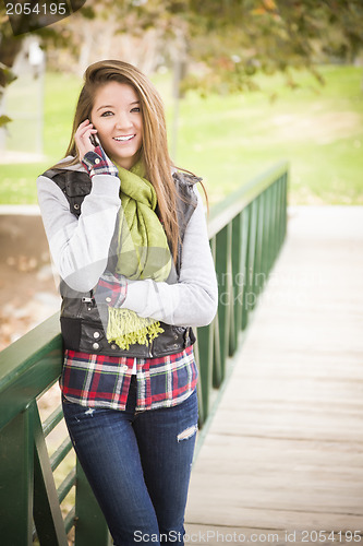 Image of Mixed Race Attractive Woman Using Cell Phone