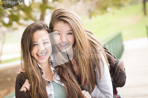 Image of Mixed Race Women Pose for a Portrait Outside