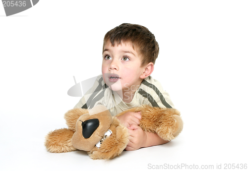 Image of Child holding a plush toy