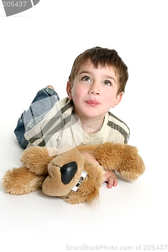 Image of Child playing with stuffed toy