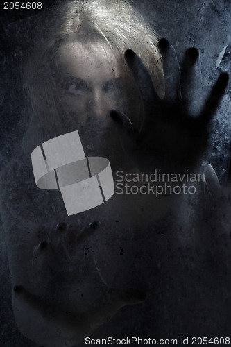 Image of Witch behind the glass