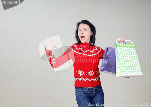Image of Woman showing the bags with gifts