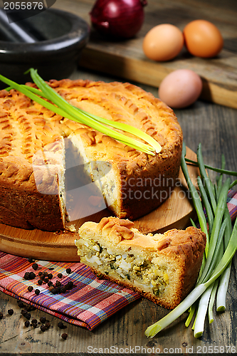 Image of Pie with egg and green onions.