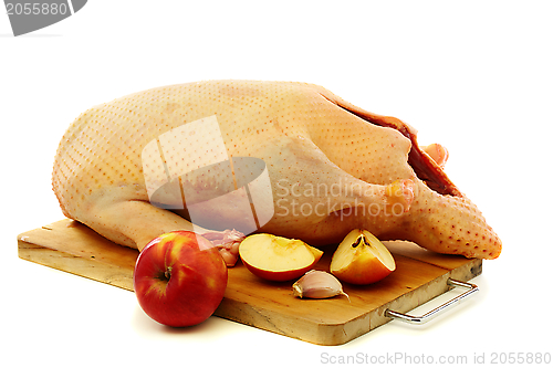 Image of Cooking duck with apples.
