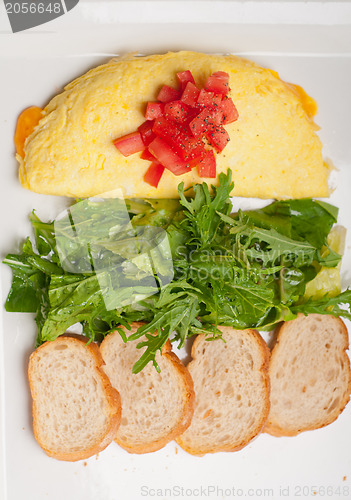 Image of cheese ometette with tomato and salad