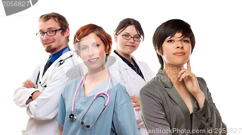 Image of Young Mixed Race Woman with Doctors and Nurses Behind
