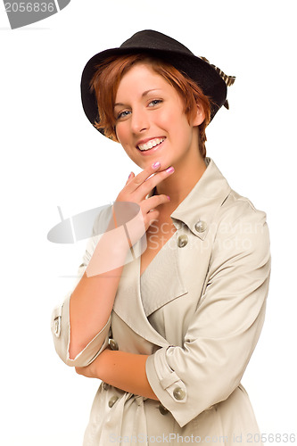 Image of Attractive Red Haired Girl Wearing a Trench Coat and Hat