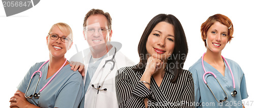 Image of Hispanic Woman with Male and Female Doctors or Nurses