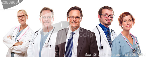 Image of Smiling Businessman with Doctors and Nurses