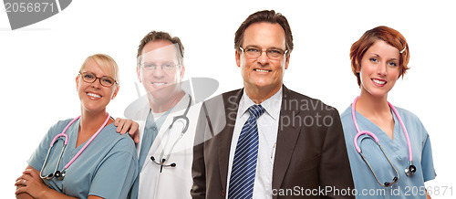 Image of Smiling Businessman with Doctors and Nurses