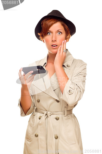 Image of Shocked Young Woman Holding Smart Cell Phone on White
