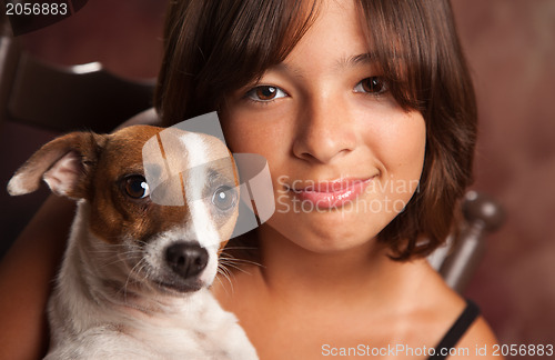 Image of Pretty Hispanic Girl and Her Puppy Studio Portrait