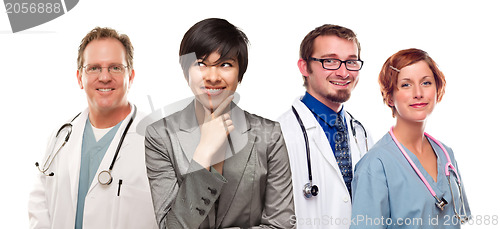 Image of Young Mixed Race Woman with Doctors and Nurses Behind